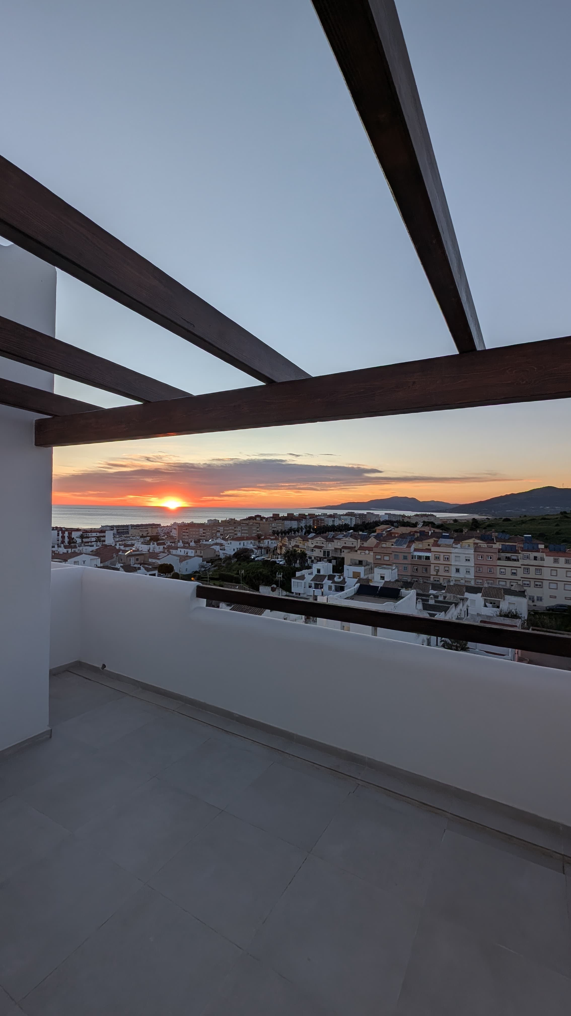 Wooden pergola terrace with Atlantic sunset
